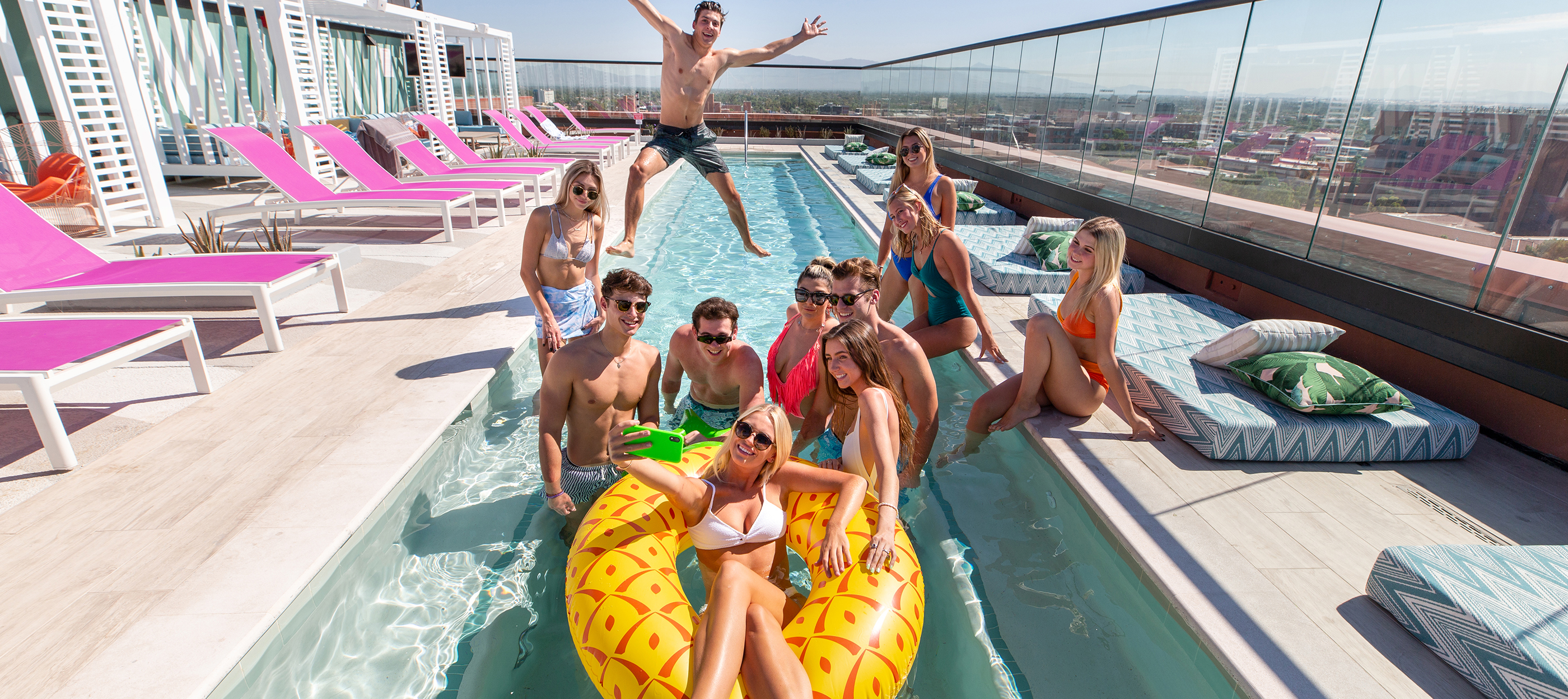 Friends posing in a swimming pool