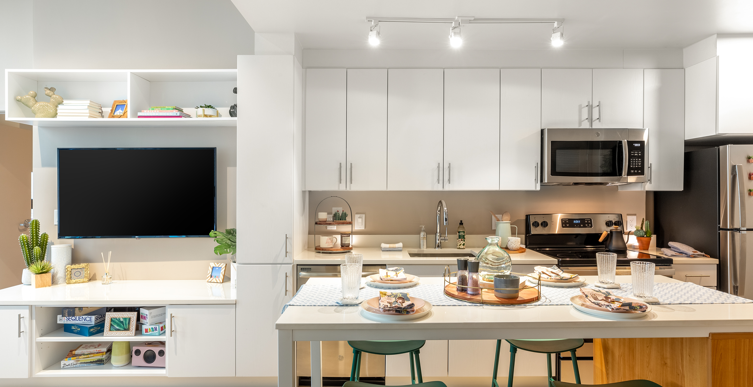 A kitchen with white cabinets