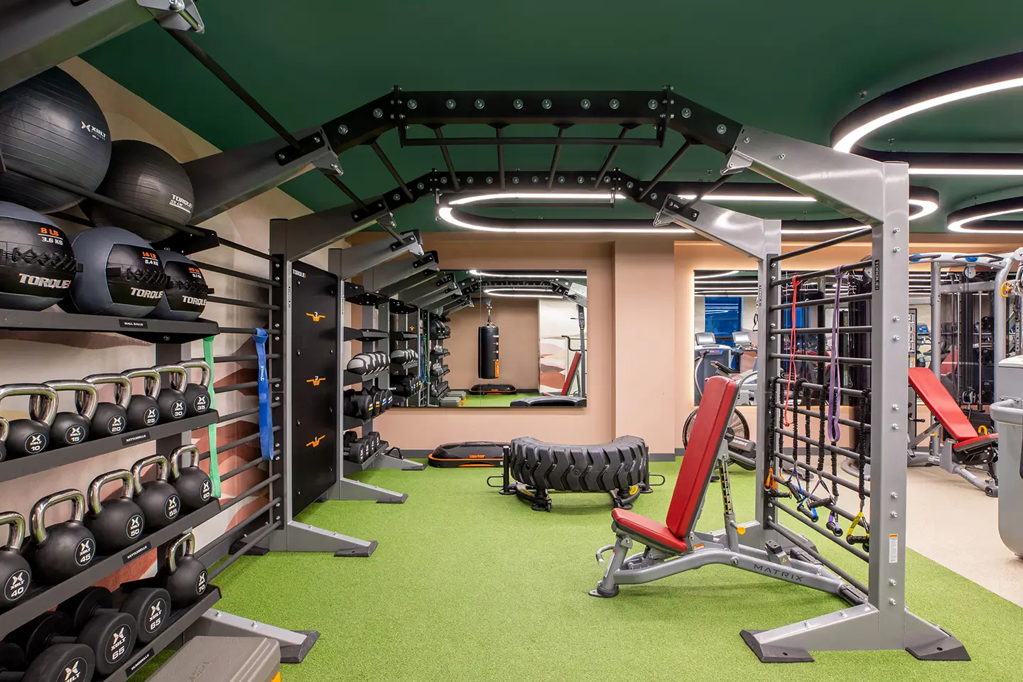 Pull up bar, bench setup, tire sled, and a heavy bag at ōLiv Tucson